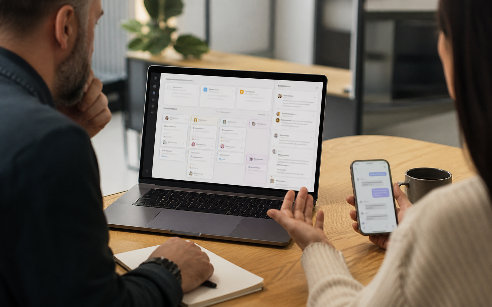 Business automation dashboard and message workflow reviewed with a client in a real office