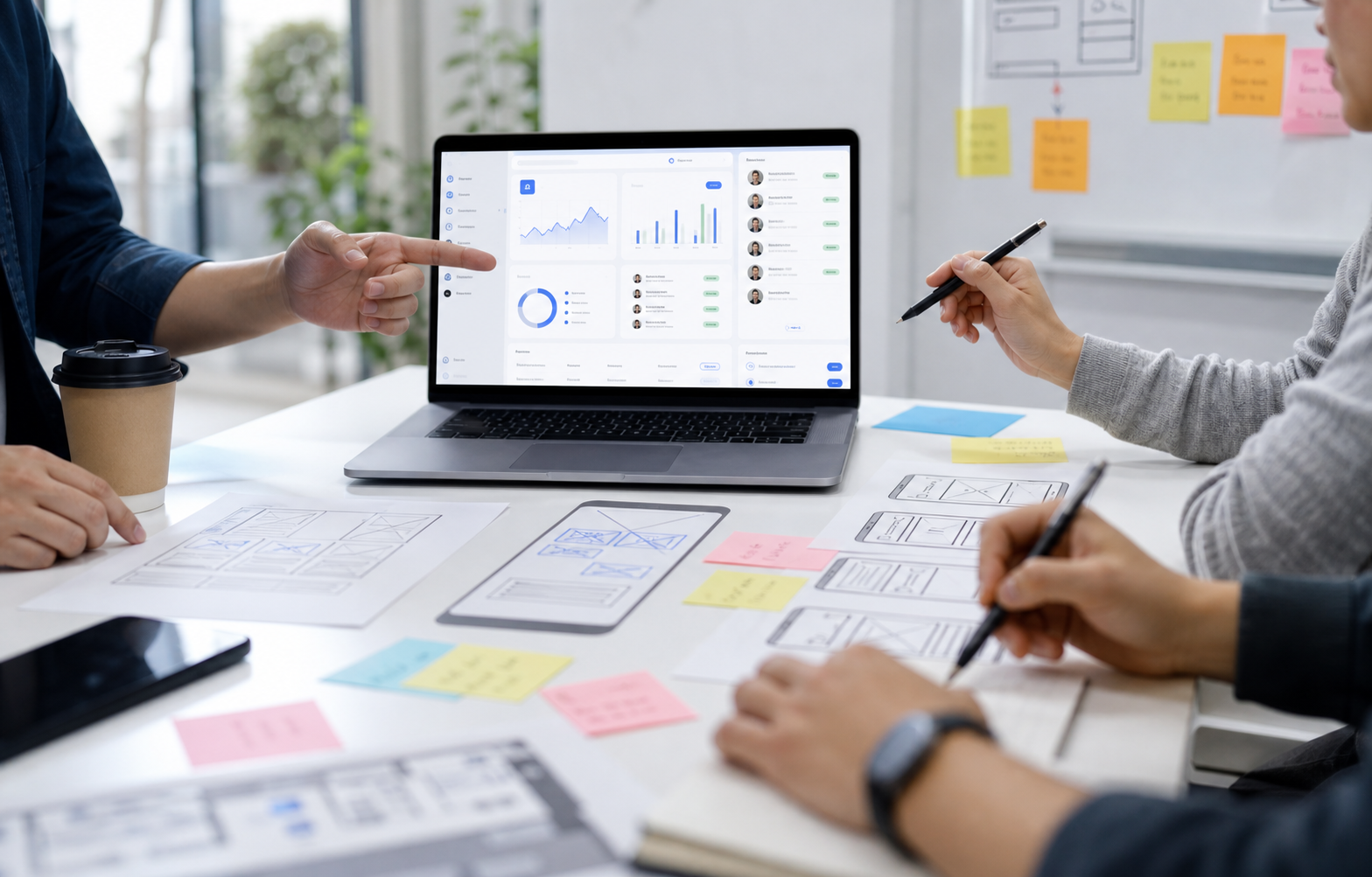 SaaS dashboard, product sketches and UX planning materials reviewed by a product team